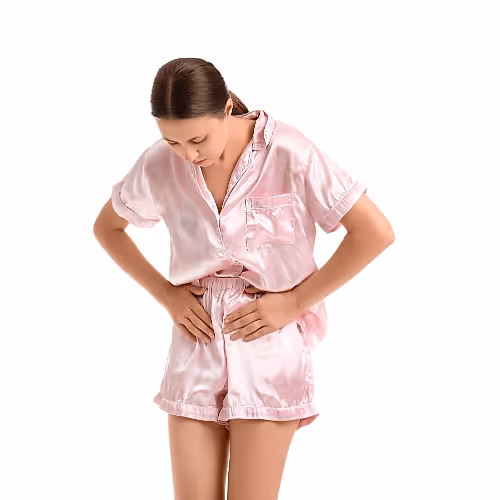 Individual practicing breathwork for urinary urgency, seated comfortably in a quiet room with soft lighting.
