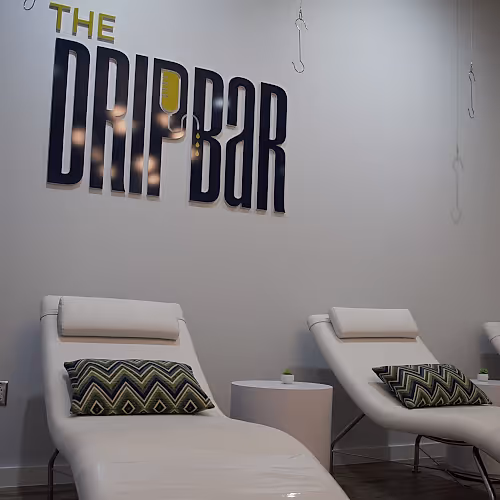 Comfortable wellness lounge with seating and soft lighting for relaxation.