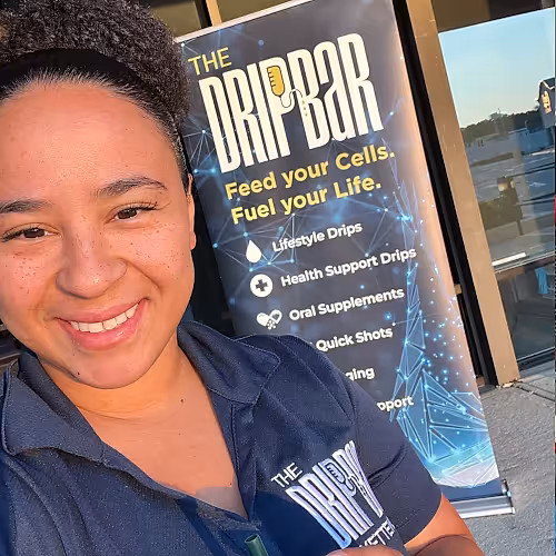 Staff at The DRIPBaR Hammond welcoming a client for a HydraFacial appointment, focusing on personalized care and a friendly atmosphere.