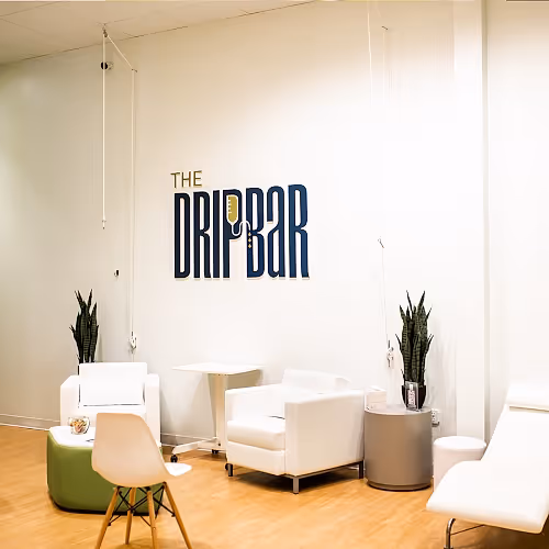 Open drip lounge at The DRIPBaR Hammond with comfortable chairs and soft lighting.