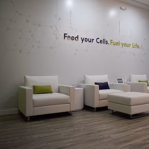 Community area in The DRIPBaR Hammond lounge, showing guests relaxing and connecting in a wellness-focused space.
