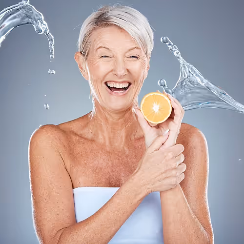 Client undergoing hydration therapy in a wellness lounge with relaxed atmosphere.