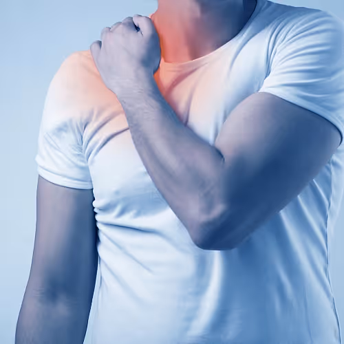 Individual using an infrared sauna to help reduce muscle stiffness and improve joint mobility.