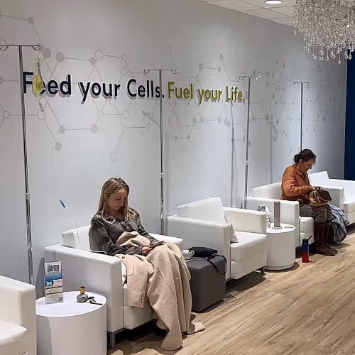 A modern lounge area where adults relax before or after IV therapy sessions for ADHD support.