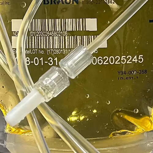 Sterile preparation area with medical supplies arranged neatly for IV drip mixing