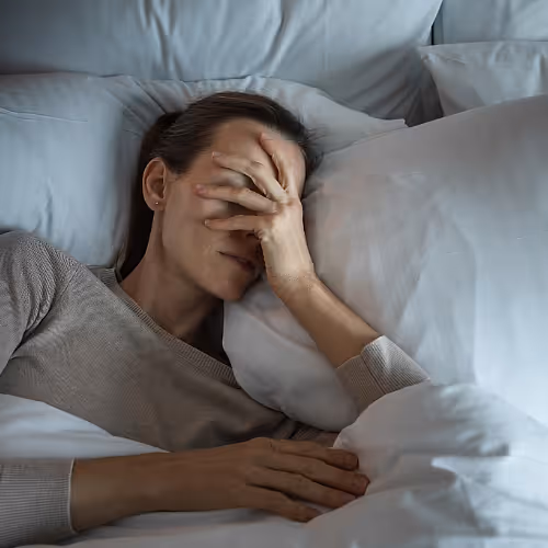 Licensed nurse prepares a nutrient infusion for a client experiencing fatigue from low thyroid hormone levels.