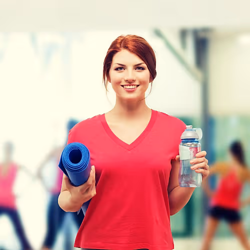 Person relaxing after exercise, receiving hydration therapy to accelerate post-workout recovery and hydration.