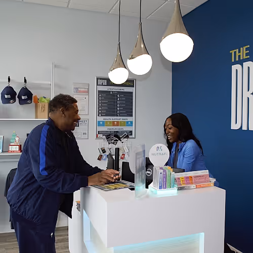 Reception area at The DRIPBaR with staff welcoming clients and managing appointments.