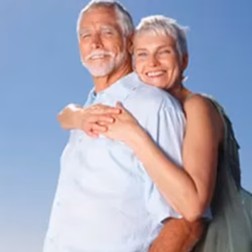 Client receiving Time Machine IV therapy in a comfortable lounge setting focused on wellness.