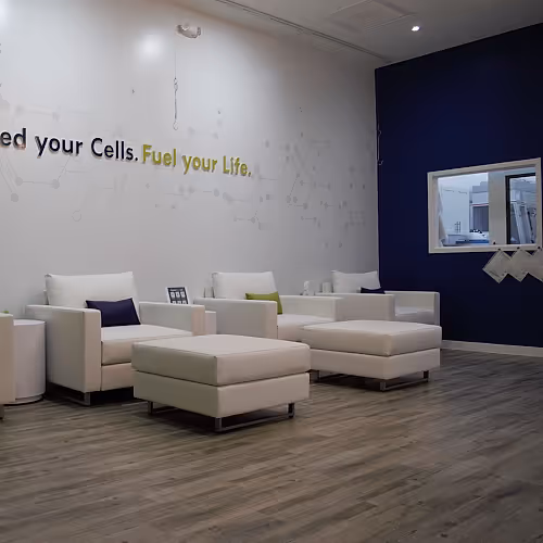 Spacious wellness lounge with natural light and comfortable seating at The DRIPBaR.